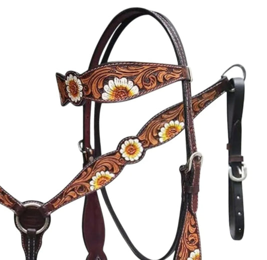 A brown leather horse halter with intricate floral tooling and painted daisy details.